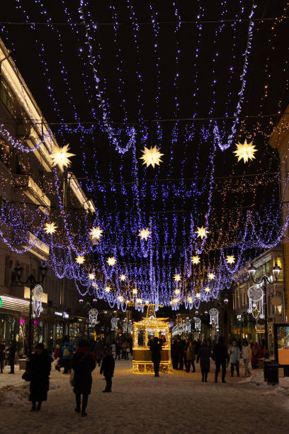 istock evening pedestrian street decorated with festive garlands 1453953496