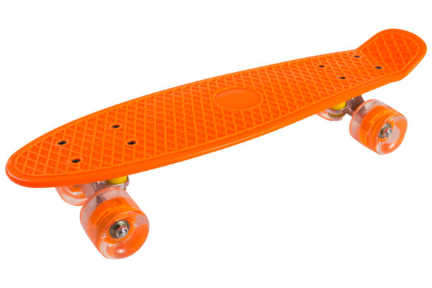 istock Orange skateboard with transparent silicone wheels, side view, on a white background 1453954430