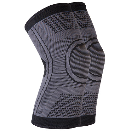 Gray sports elastic knee pads, for fixing and supporting joints, on a white background, isolate
