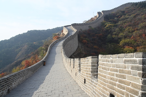 A scenic view of the Great Wall of China on a sunny day