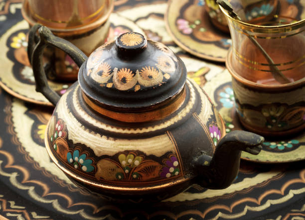 istock Turkish copper painted teapot and glass cup 1453958707