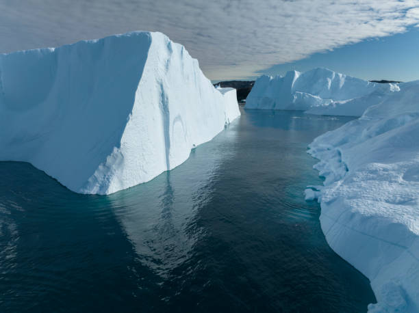 istock big icebergs floating over sea from aerial view 1453959637