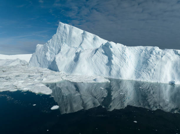 istock big icebergs floating over sea from aerial view 1453959638