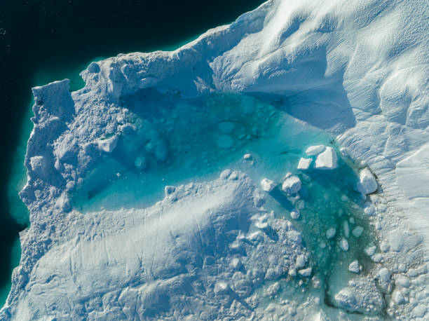 istock big icebergs floating over sea from aerial view 1453959688