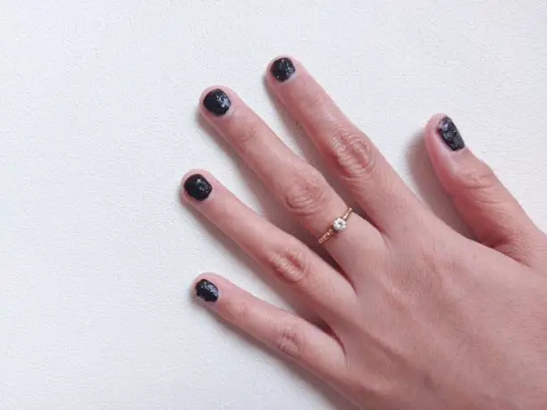 Photo of Woman nails using henna paste.