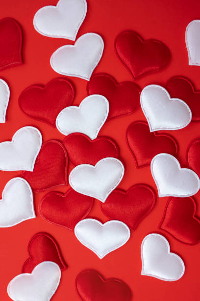 istock A lot of hearts on a red background. Valentine's Day concept. Vertical image. 1453962949