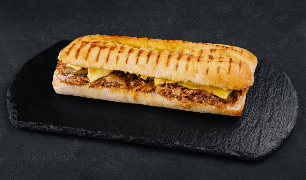 istock long sandwich with chicken, cucumbers and cheese 1453963883