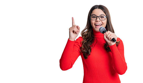 inspired with idea of teen girl singer isolated on white background. teen girl singer in studio. teen girl singer with microphone. photo of teen girl singer.