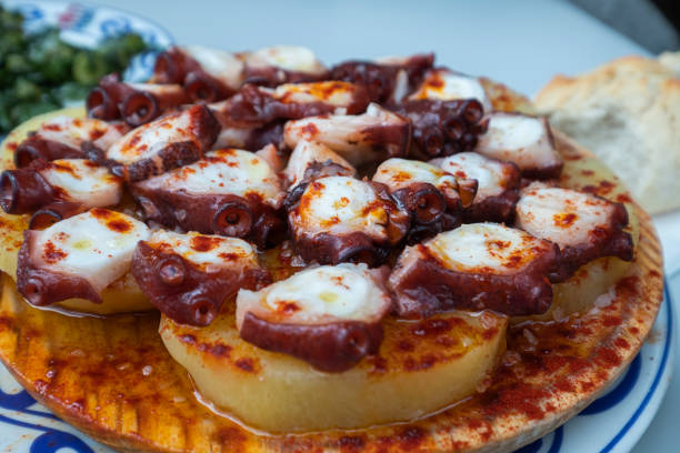istock Octopus with potato baked in olive oil, traditional Spanis dish 1453964005