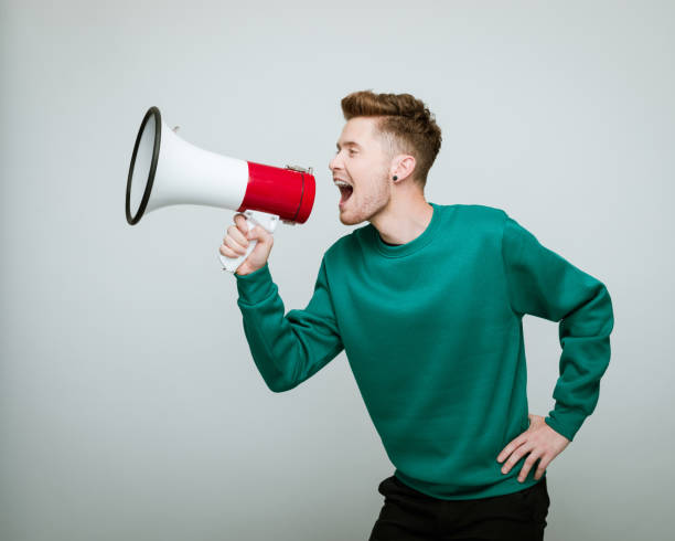 Young volunteer shouting into megaphone