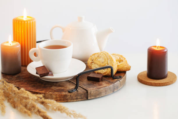 istock still life with burning candles in white modern interior 1453965055