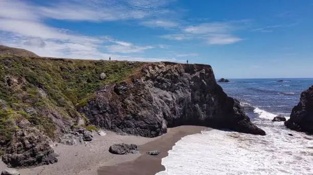 A drone shot of a huge rock on Goat Rock Beach in Jenner, California, USA
