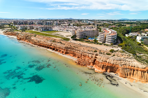 The aerial shot  Dehesa de Campoamor coastal townscape with sandy beach Costa Blanca,  Spain