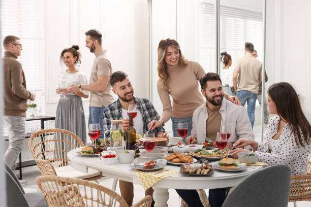 istock Group of people having brunch together indoors 1453969337