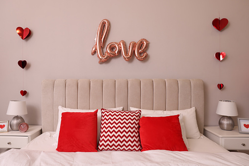 Cozy bedroom decorated for Valentine Day. Interior design