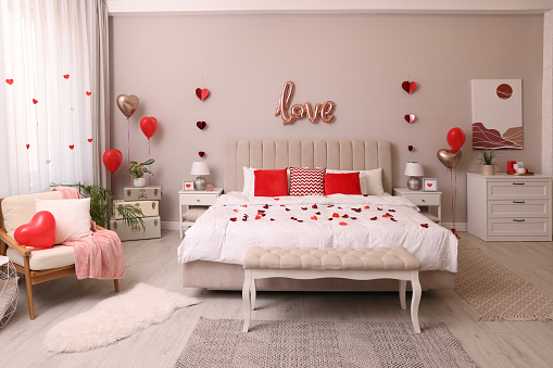 Cozy bedroom decorated for Valentine Day. Interior design
