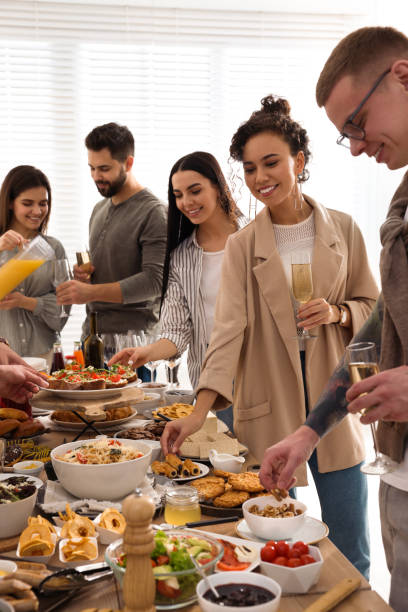 istock Group of people enjoying brunch buffet together indoors 1453970547