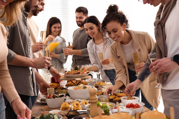 istock Group of people enjoying brunch buffet together indoors 1453970638
