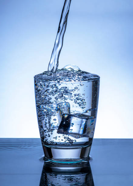 istock The image of pouring drinking water, into a glass, 1453971034