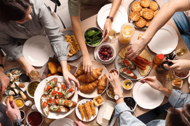 istock Group of people having brunch together at table, top view 1453971123