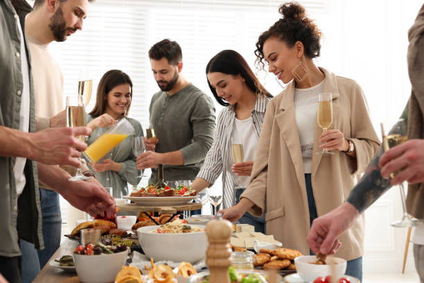 istock Group of people enjoying brunch buffet together indoors 1453971940