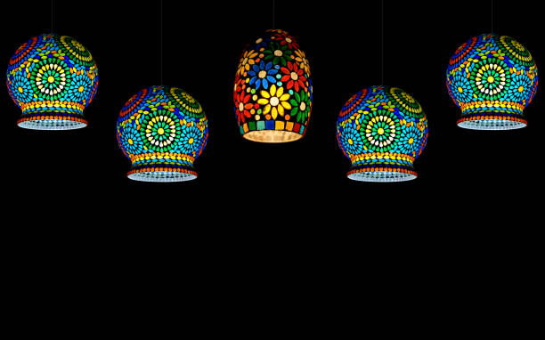 Glass circular hanging lights. Bulb Glass Antique Mosaic Hanging Lamps on black background. stock photo