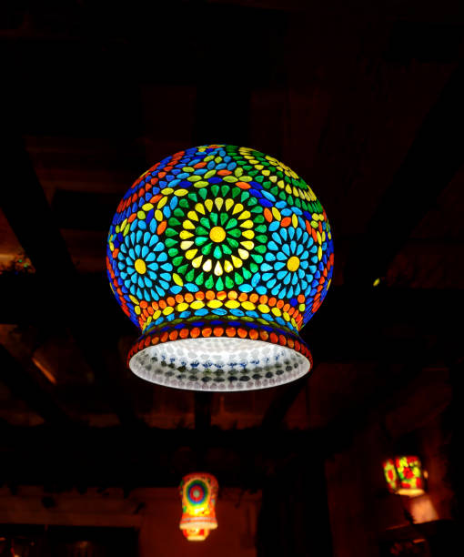 Glass circular hanging light, Chinese lanterns at night. Bulb Glass Antique Mosaic Hanging Lamp. Interior light decor. stock photo