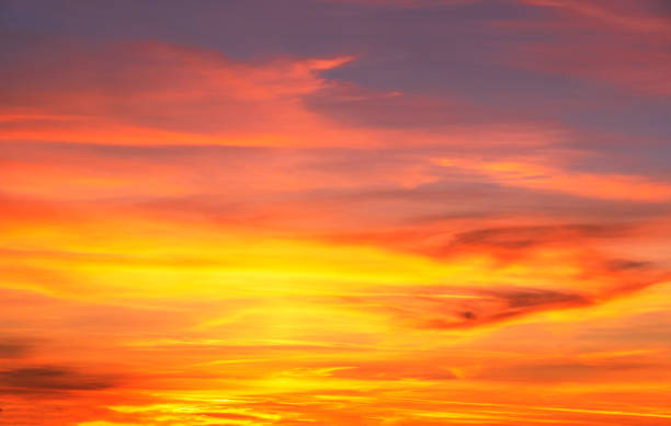 istock sky with gentle colorful clouds. Panoramic view of real sunset orange sunset 1453972048