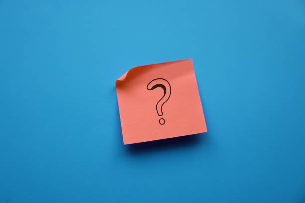 Adhesive note with question mark stock photo