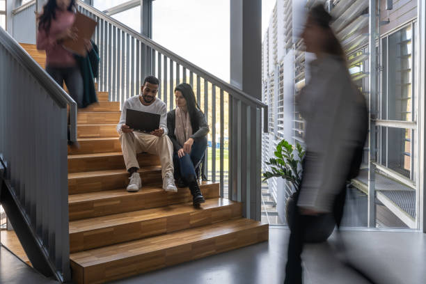 istock Students are talking on the stairs of the university. 1453972989