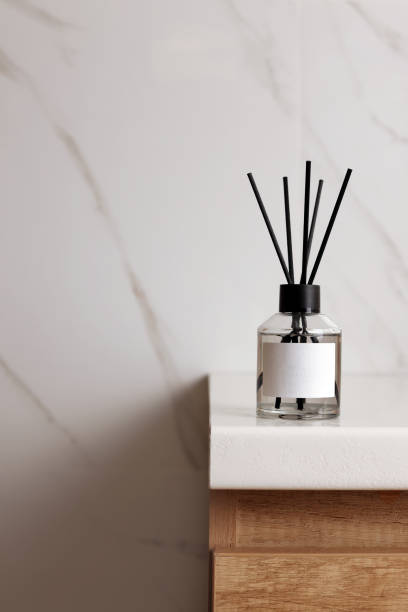 istock Aromatic reed air freshener on white table indoors, space for text 1453974399