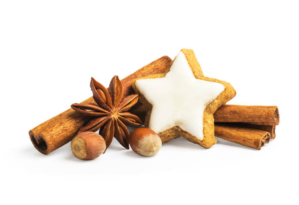 istock Star shape christmas gingerbread cookies with cinnamon and anise on a white background 1453976328