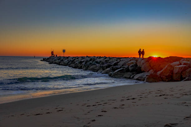istock Sunrise at the Virginia Beach jetty 1453978993
