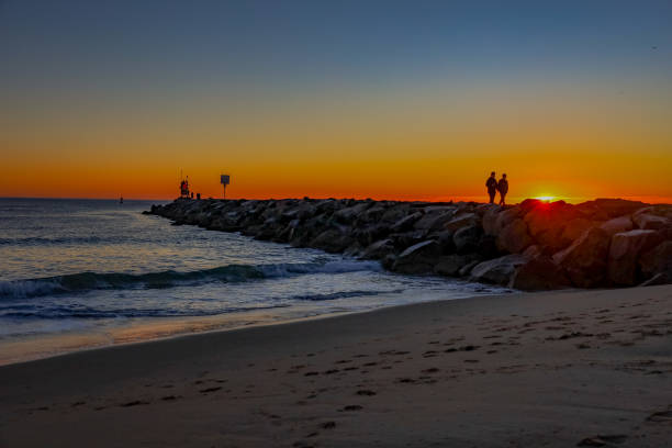 Sunrise at the Virginia Beach jetty stock photo
