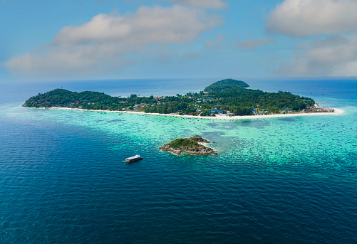 The tropical with seashore island in a coral reef ,blue and turquoise sea Amazing nature landscape with blue lagoon-Above view