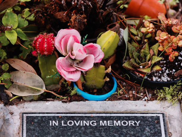 Inscription in granite tombstone reads \
