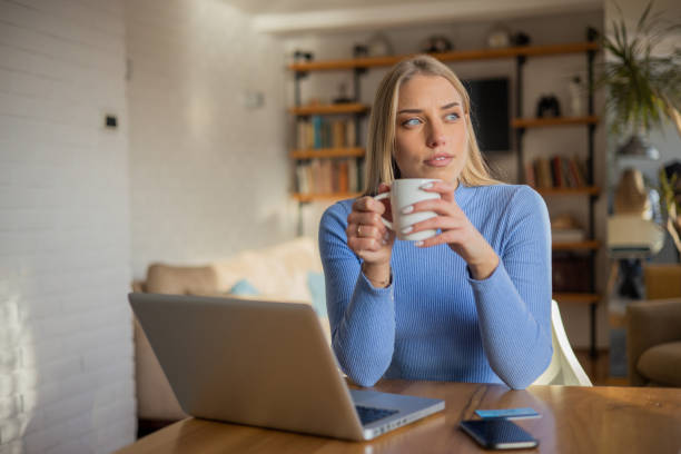 istock Young woman working from home 1453982039