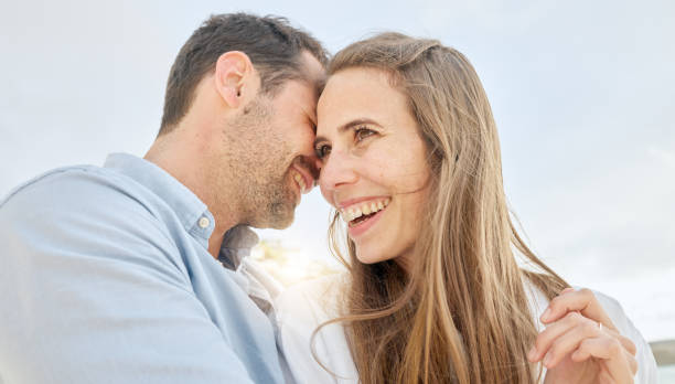 istock Love, happy and vacation with a couple on a date, bonding during summer while laughing or joking together. Sky, travel and smile with a man and woman enjoying a romantic holiday outside in the day 1453983413