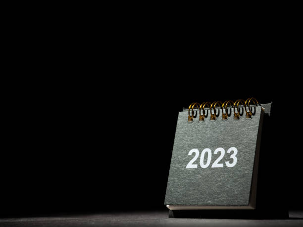2023 desk calendar on black background stock photo