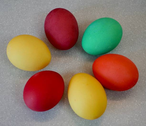 istock Eggs painted with monochrome paint. Colorful eggs for Easter. Frosted eggs for Easter. Traditional Easter egg paints. Uniformly colored eggs for Easter. 1453985094