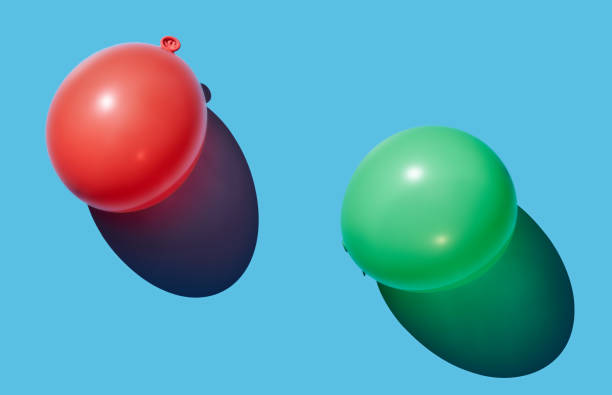 istock Green and pink balloon on blue pastel background 1453985652