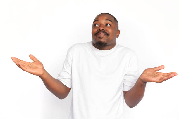 istock Pleased African American man shrugging 1453986484