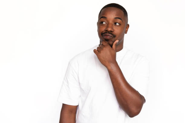 istock Pensive African American man touching chin 1453986654