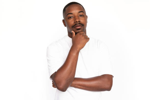 istock Pensive African American man rubbing chin 1453986718