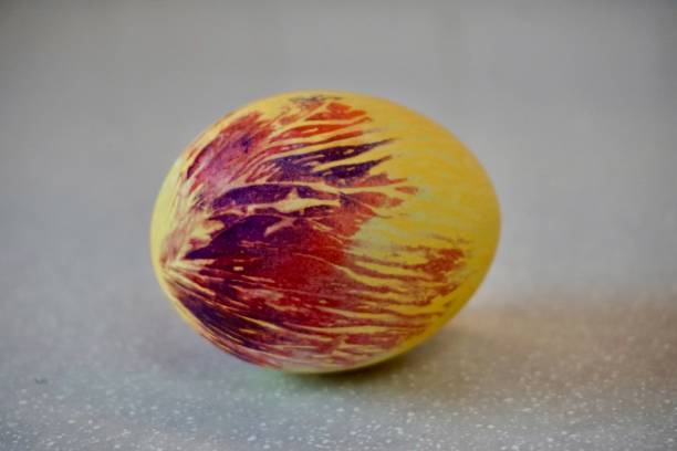 istock Colorful Easter egg. A beautiful Easter egg with an unusual coloring. The original coloring of the Easter egg. An interesting method of coloring an Easter egg. 1453987155