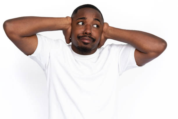 istock Frustrated African American man covering ears 1453987182