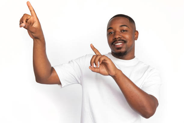istock Excited African American man pointing up at ads 1453987353