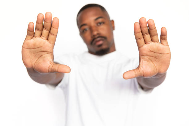 istock Dissatisfied African American man showing open palms 1453987416