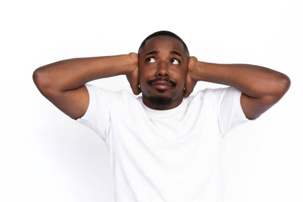 istock Annoyed African American man covering ears 1453988872