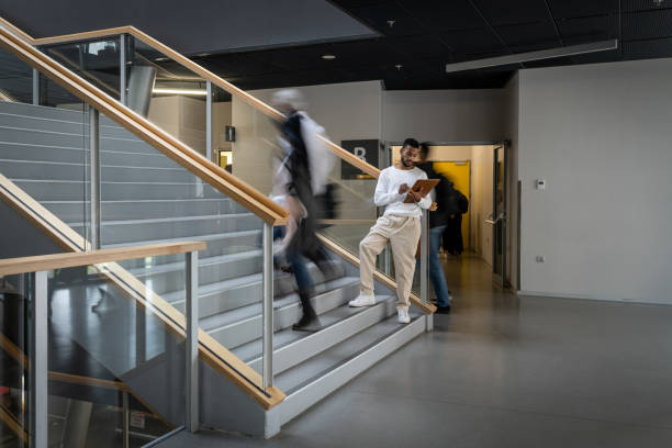 istock Students in motion on the stairs. 1453989882
